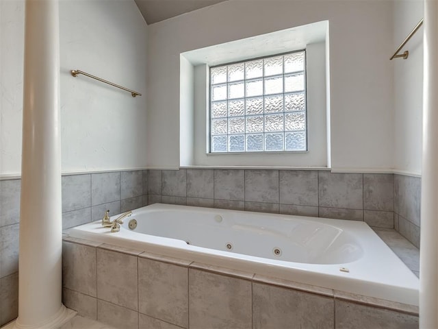 full bath featuring a tub with jets