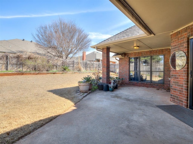 view of patio / terrace featuring fence