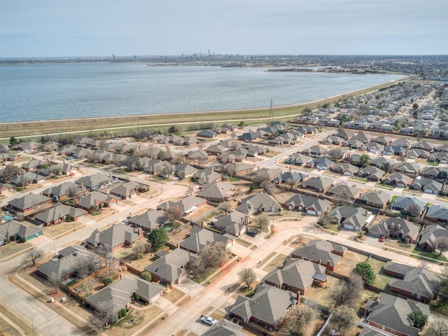 birds eye view of property featuring a residential view and a water view