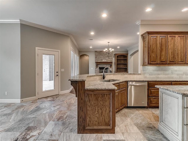 kitchen featuring a sink, backsplash, stainless steel dishwasher, brown cabinetry, and crown molding