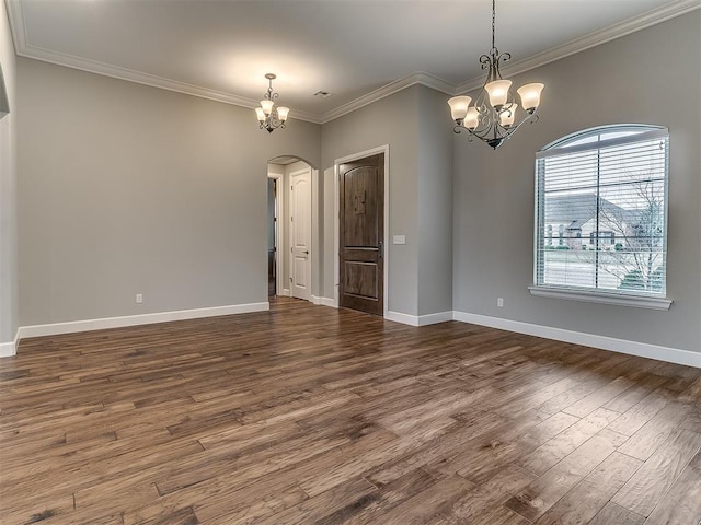 unfurnished room featuring baseboards, arched walkways, dark wood-style flooring, and a chandelier