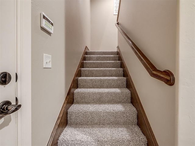 stairs featuring baseboards