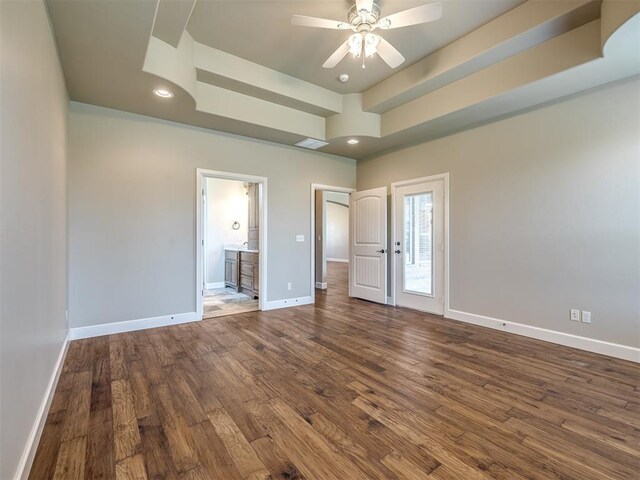 unfurnished bedroom featuring visible vents, baseboards, recessed lighting, dark wood-type flooring, and connected bathroom