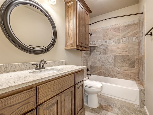 bathroom featuring vanity, toilet, and shower / washtub combination