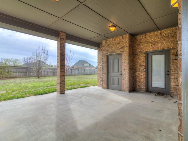 view of patio featuring fence