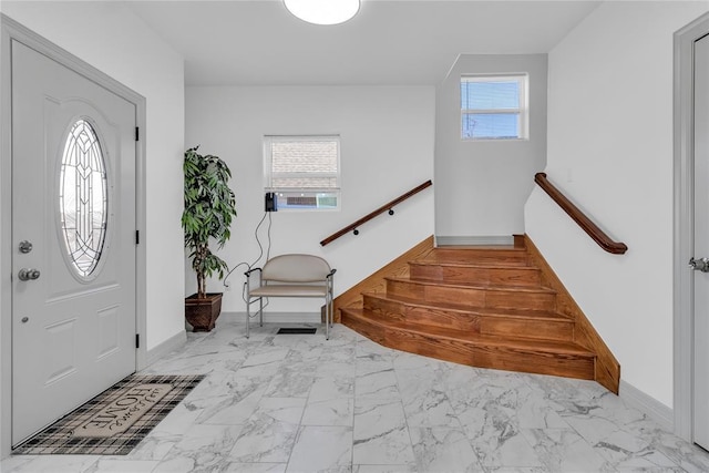 1612 N Klein Ave, Oklahoma City, OK 73106 - foyer entrance with plenty of natural light, marble finish floor, stairs, and baseboards