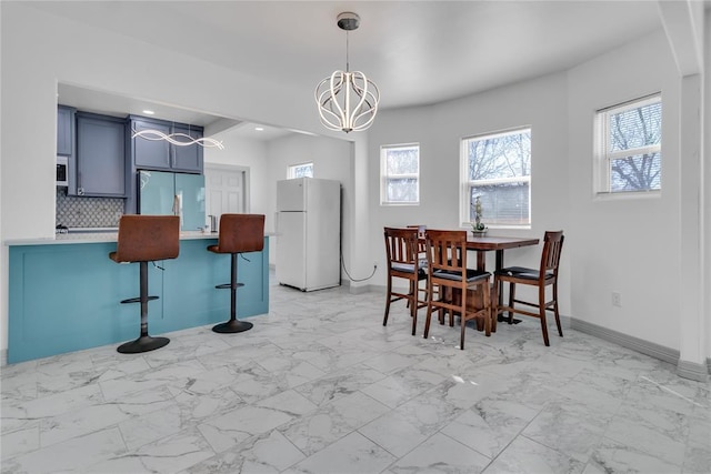 1612 N Klein Ave, Oklahoma City, OK 73106 - dining room with recessed lighting, baseboards, and marble finish floor