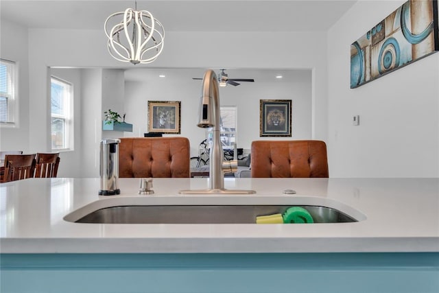 1612 N Klein Ave, Oklahoma City, OK 73106 - kitchen with a chandelier, open floor plan, pendant lighting, and a sink