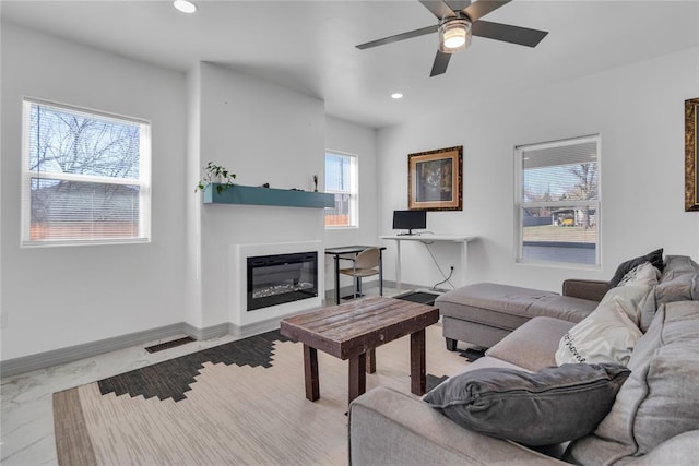 1612 N Klein Ave, Oklahoma City, OK 73106 - living area featuring visible vents, baseboards, recessed lighting, a glass covered fireplace, and marble finish floor