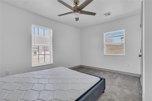 1612 N Klein Ave, Oklahoma City, OK 73106 - carpeted bedroom featuring a ceiling fan, baseboards, and visible vents
