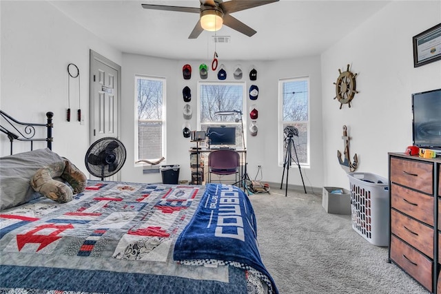 1612 N Klein Ave, Oklahoma City, OK 73106 - bedroom with baseboards, visible vents, carpet floors, and ceiling fan
