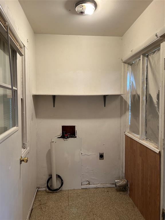 laundry room with hookup for an electric dryer and laundry area