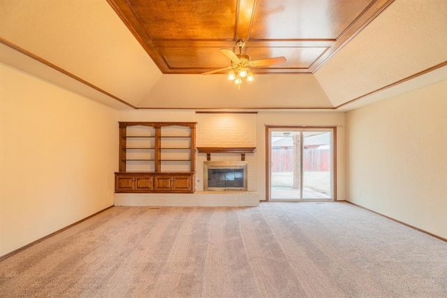 unfurnished living room with light colored carpet, baseboards, a raised ceiling, and a ceiling fan