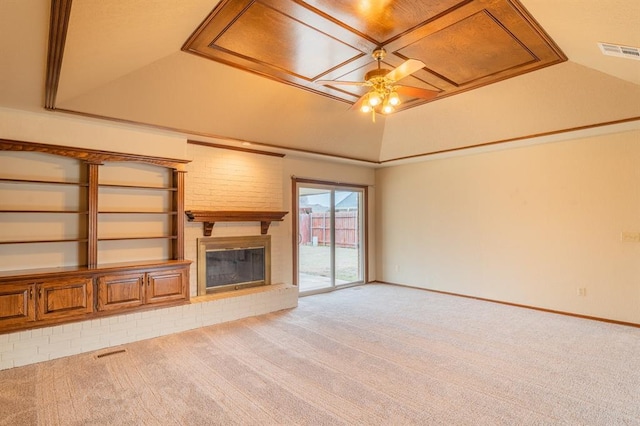 unfurnished living room featuring visible vents, a fireplace, carpet, and ceiling fan