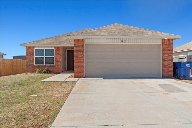 single story home featuring brick siding, a front lawn, and fence