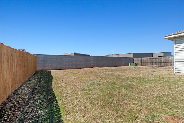 view of yard with a fenced backyard