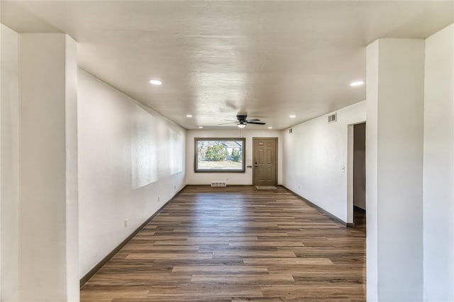 unfurnished room with ceiling fan, visible vents, wood finished floors, and recessed lighting