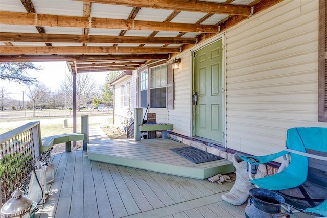 wooden terrace featuring covered porch