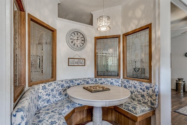 dining area featuring breakfast area and wood finished floors