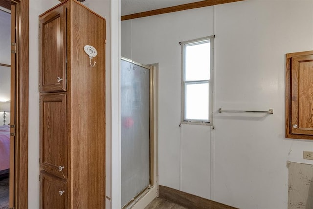 bathroom with a stall shower and connected bathroom