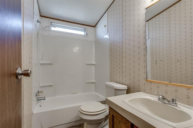 bathroom with wallpapered walls,  shower combination, toilet, and vanity