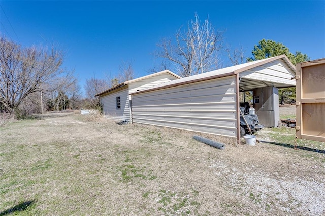 view of side of home with a yard