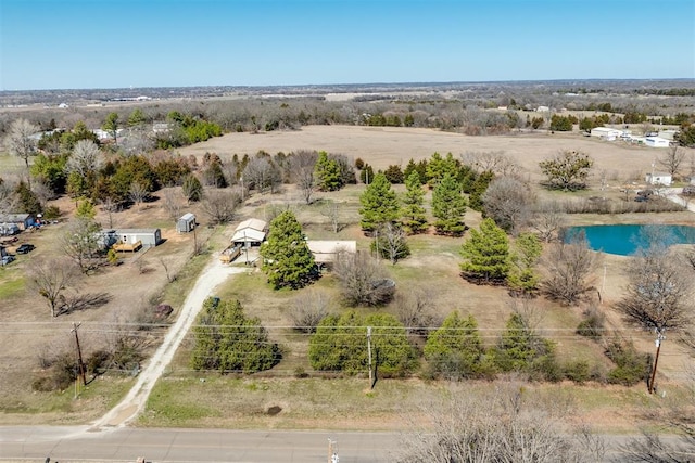 birds eye view of property featuring a rural view and a water view