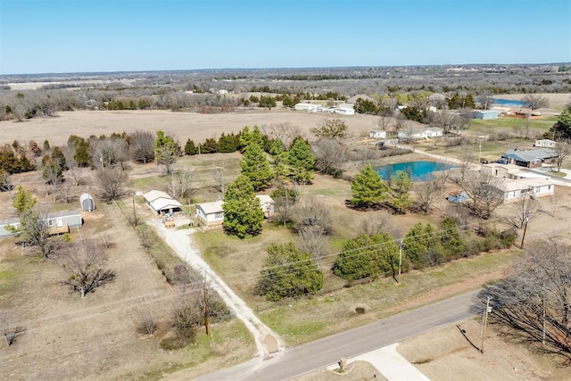 birds eye view of property with a rural view