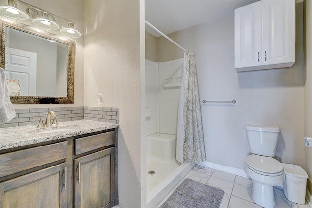 full bathroom with a shower stall, baseboards, toilet, decorative backsplash, and vanity