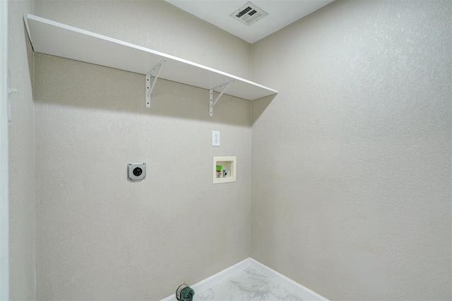 laundry area with visible vents, baseboards, washer hookup, laundry area, and marble finish floor