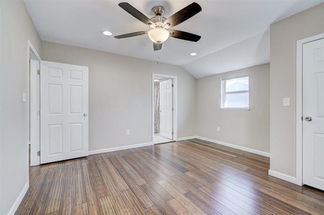 unfurnished bedroom featuring a ceiling fan, wood finished floors, recessed lighting, baseboards, and vaulted ceiling