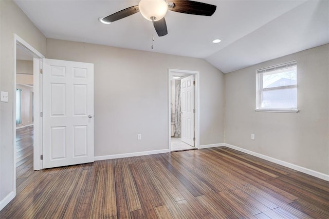 unfurnished bedroom with wood finished floors, baseboards, lofted ceiling, ceiling fan, and ensuite bathroom