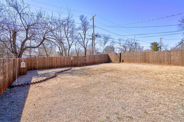 view of yard with a fenced backyard