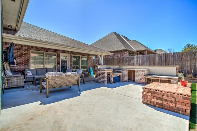 view of patio / terrace featuring an outdoor hangout area, area for grilling, and fence