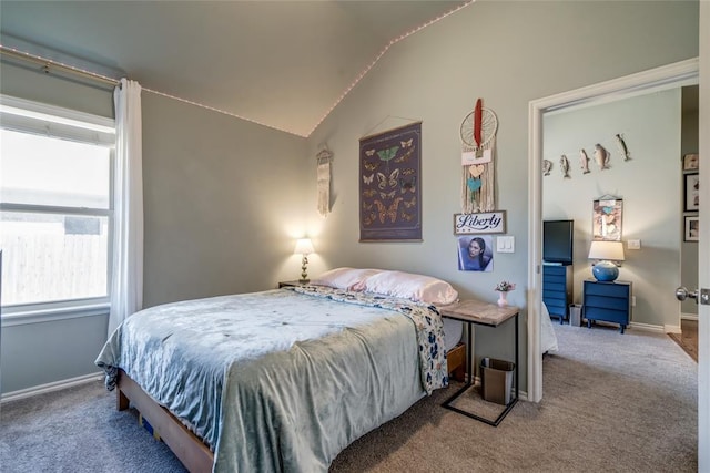 bedroom with baseboards, carpet flooring, and vaulted ceiling