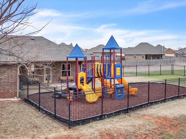 communal playground featuring fence