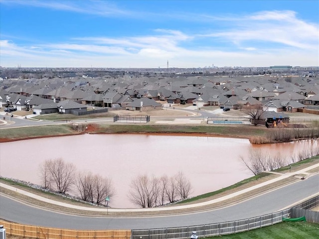 bird's eye view featuring a residential view and a water view