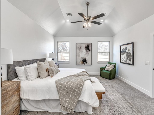 carpeted bedroom with visible vents, multiple windows, baseboards, and vaulted ceiling