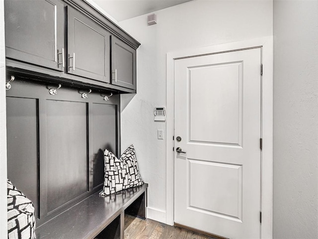 mudroom with baseboards and light wood-style flooring