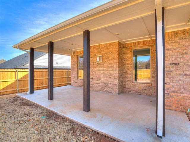 view of patio featuring fence