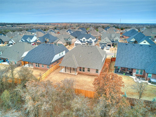 birds eye view of property with a residential view