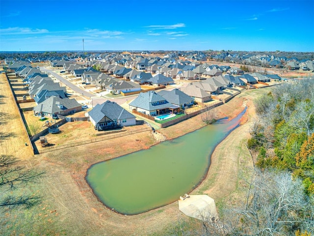 bird's eye view featuring a residential view and a water view