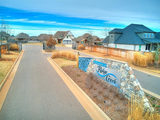 view of street with curbs and a residential view