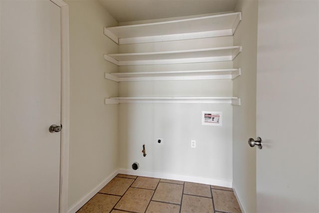 clothes washing area featuring electric dryer hookup, tile patterned flooring, baseboards, hookup for a washing machine, and laundry area