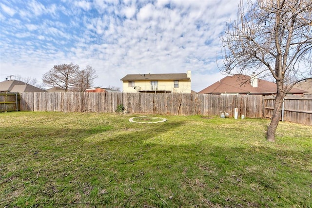 view of yard featuring a fenced backyard