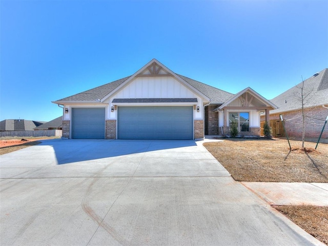 view of front of home featuring brick siding, an attached garage, board and batten siding, fence, and driveway