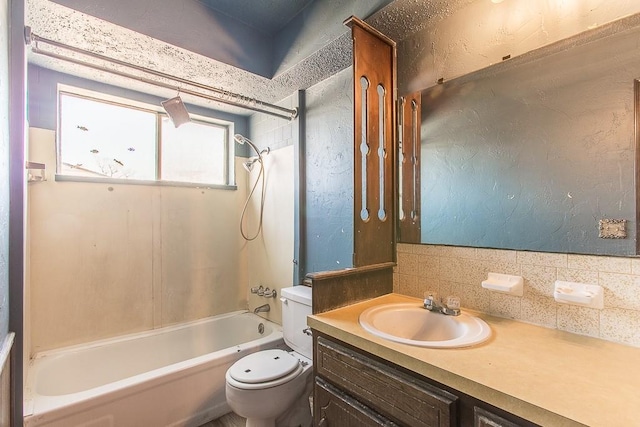 bathroom featuring vanity,  shower combination, toilet, and backsplash