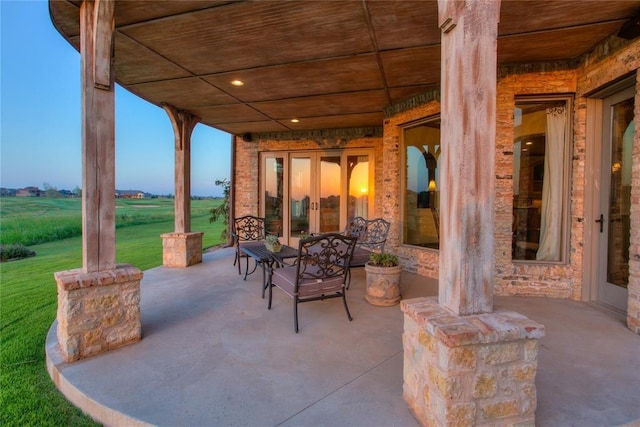 view of patio / terrace featuring french doors and a rural view