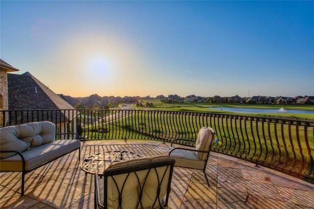 wooden deck with a yard, a water view, and an outdoor hangout area