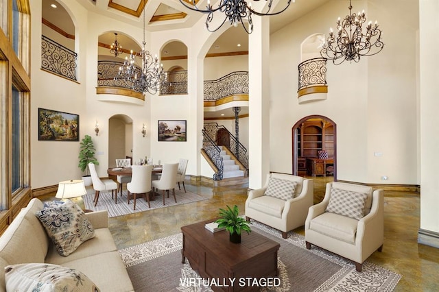 living area featuring stairway, baseboards, arched walkways, and a chandelier